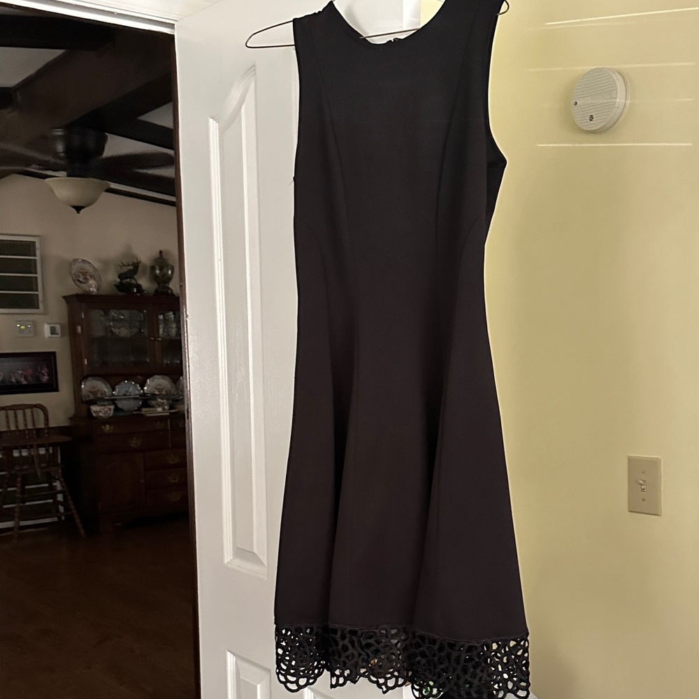 Maia Elegant Black Sleeveless Dress with Lace Hem